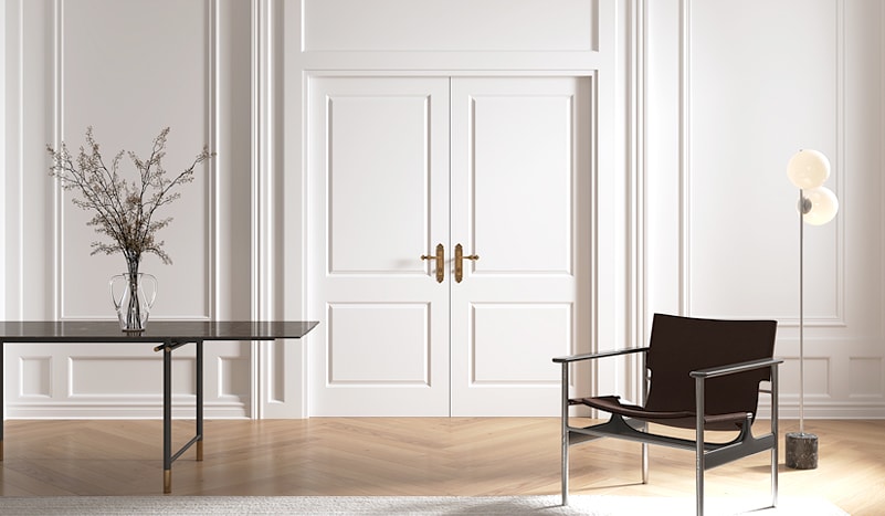 Large white room with double panelled doors and mouldings