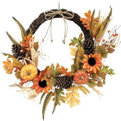 Fall wreath with pumpkins, pinecones and sunflowers