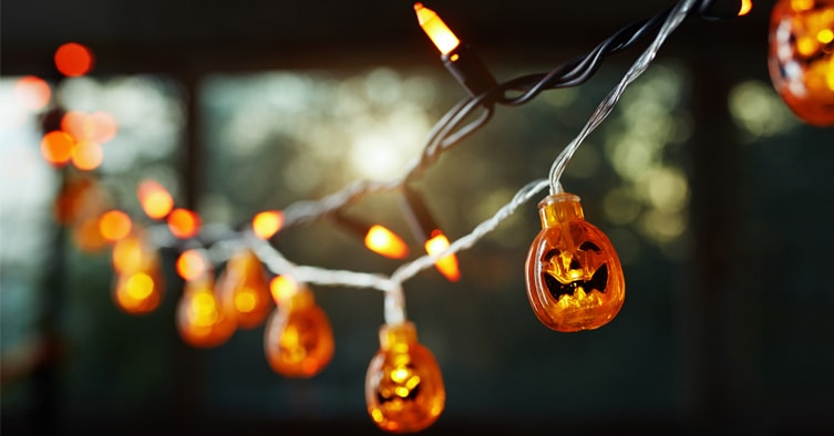 Orange string lights with tiny pumpkins 
