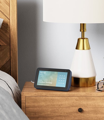 Amazon Echo Show device on a side table