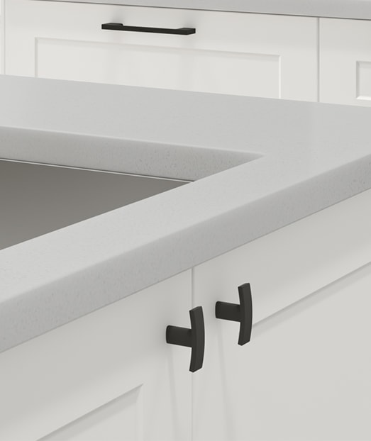 White kitchen cabinets with matte black handles