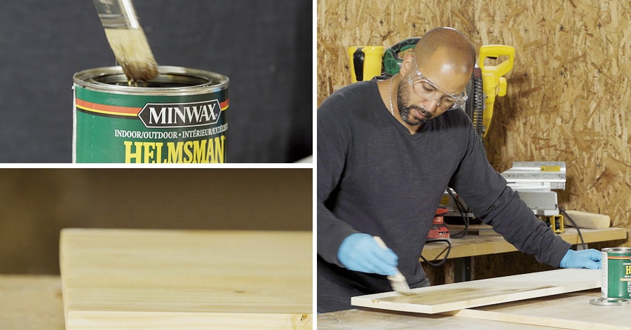 Person staining wood shelves with a paint brush