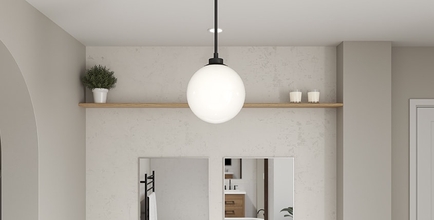Matte black suspended lighting fixture with glass globe